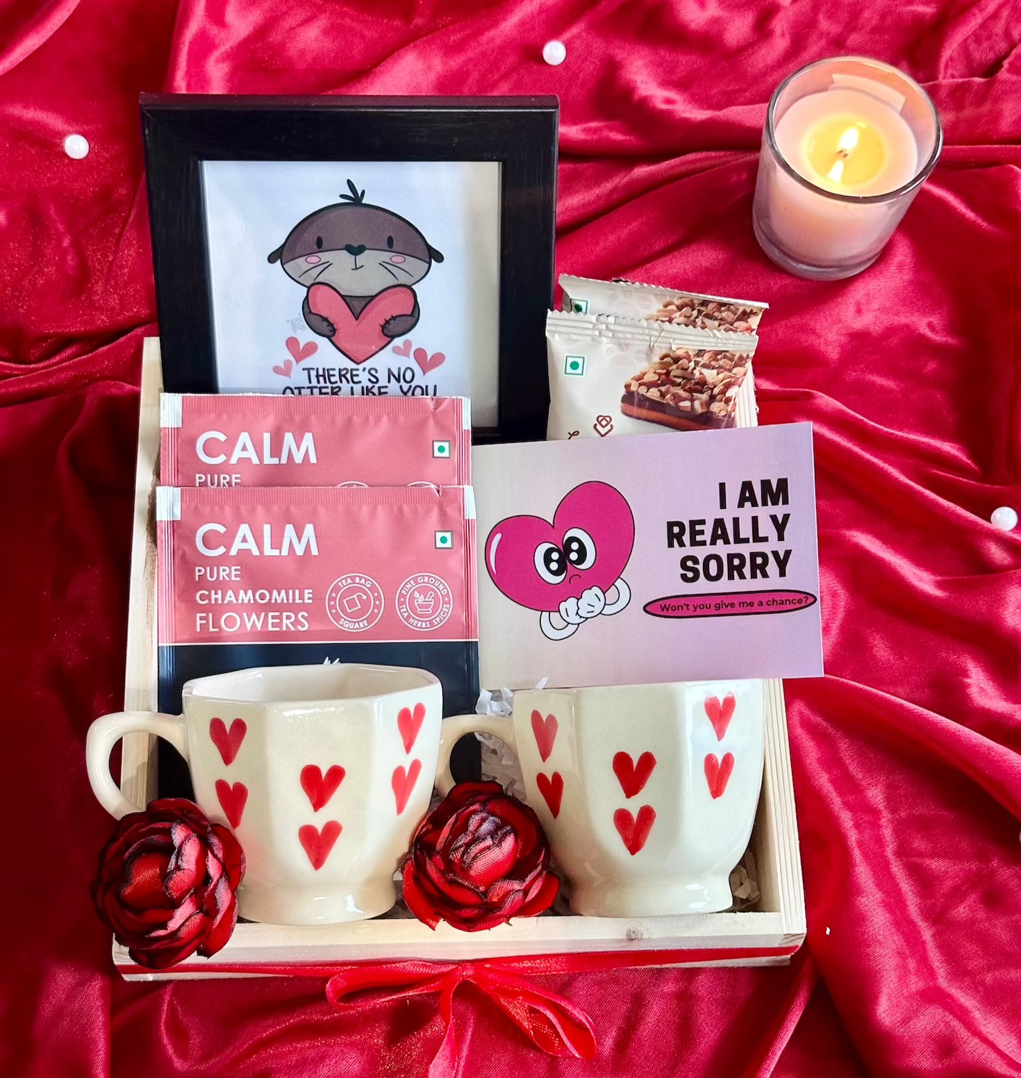 "I am sorry" hamper which contains 
Mini Pinewood Organizer, 2 Mini Heart Cups, Loykaa Almond Brittle (set of 2)
Photo Frame, 2 Calm Tea Sachets
"I am sorry" Gift Card, Red Ribbon Bow and Artifical Red Decorative Flowers